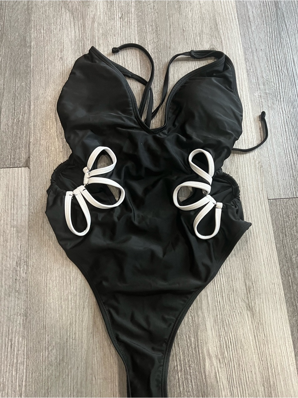Black One-Piece Swimsuit with White Floral Cutout Accents
